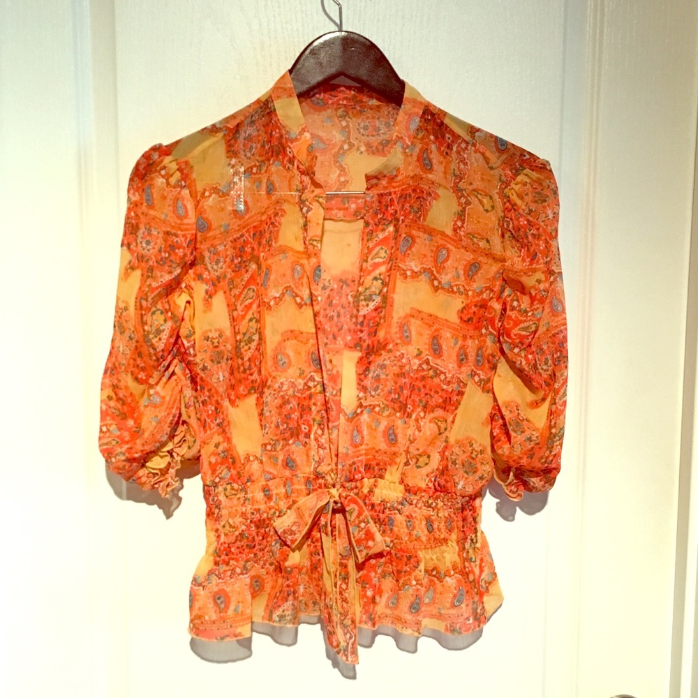 Sheer orange shirt with paisley design
